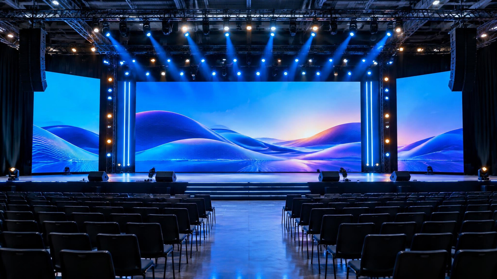 Event stage with large screens and lighting rig